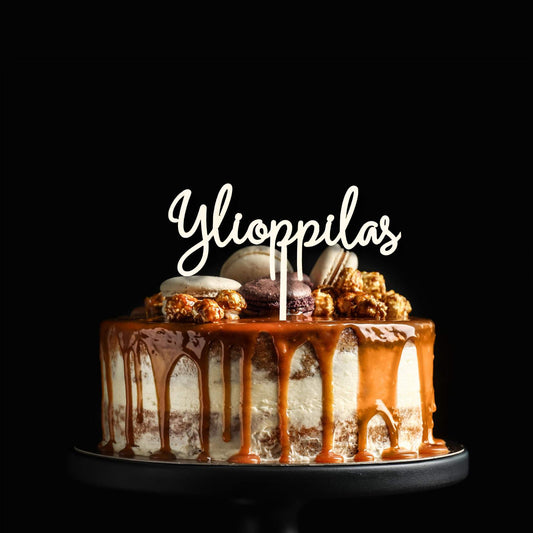 Puinen kakkukoriste ylioppilasjuhliin