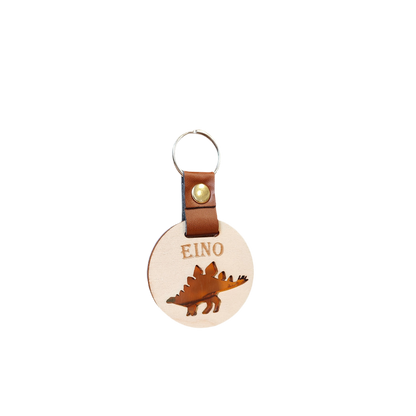 Dinosaurus avaimenperä, dino-reppumerkki, stegosaurus koulureppuun lapsen omalla nimellä.